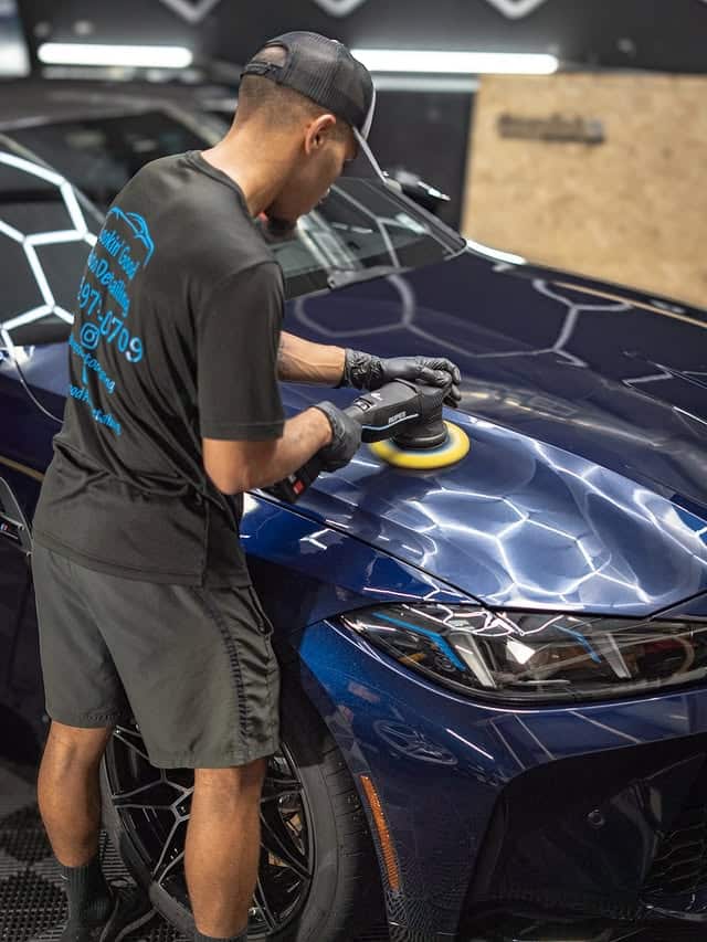 Paint correction on the hood of a blue BMW M4 before coating