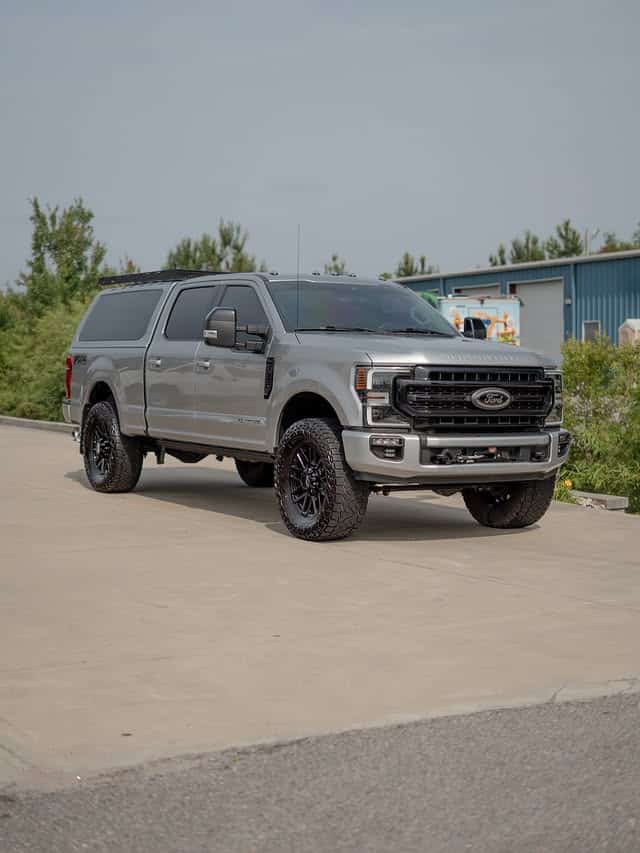 Ceramic coated silver Ford F-250 Tremor with a bed cap