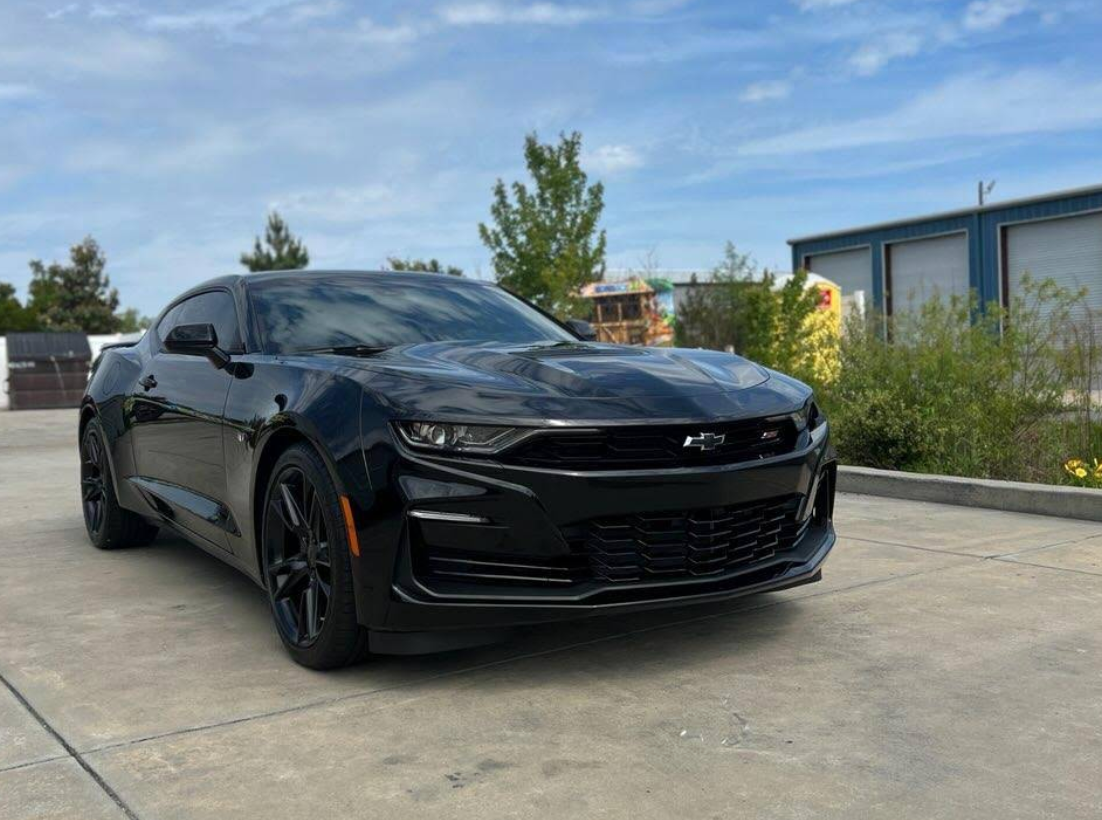 Black Chevrolet Camaro SS with tinted windows